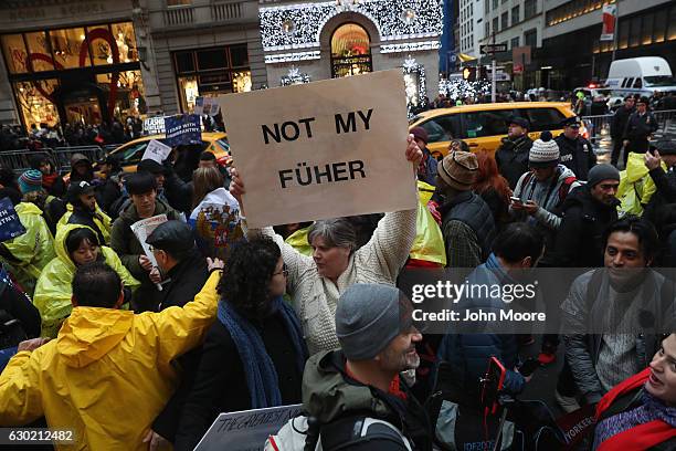 Hundreds of New Yorkers mark International Migrants Day by protesting outside Trump Tower after marching from UN on December 18, 2016 in New York...