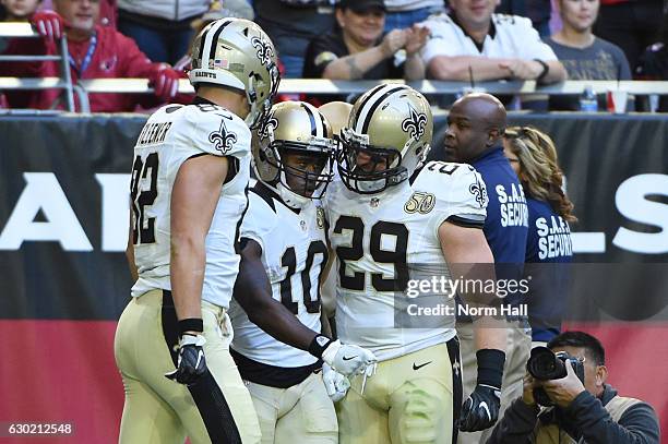 Wide receiver Brandin Cooks of the New Orleans Saints celebrates with tight end Coby Fleener and fullback John Kuhn after scoring a 45 yard touchdown...