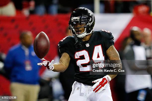 Devonta Freeman of the Atlanta Falcons celebrates a touchdown during the first half against the San Francisco 49ers at the Georgia Dome on December...