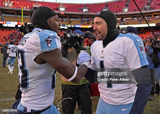 Kicker Ryan Succop of the Tennessee Titans celebrates with teammate wide receiver Harry Douglas, after kicking the winning field goal to beat the...