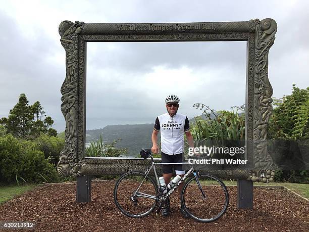 Lance Armstrong poses for a photo at the Arataki Visitor Centre during a ride with local cyclists in Auckland's Waitakere Ranges on December 19, 2016...