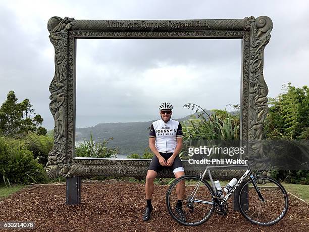 Lance Armstrong poses for a photo at the Arataki Visitor Centre during a ride with local cyclists in Auckland's Waitakere Ranges on December 19, 2016...