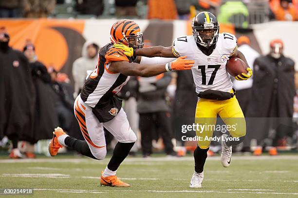George Iloka of the Cincinnati Bengals attempts to tackle Eli Rogers of the Pittsburgh Steelers during the fourth quarter at Paul Brown Stadium on...