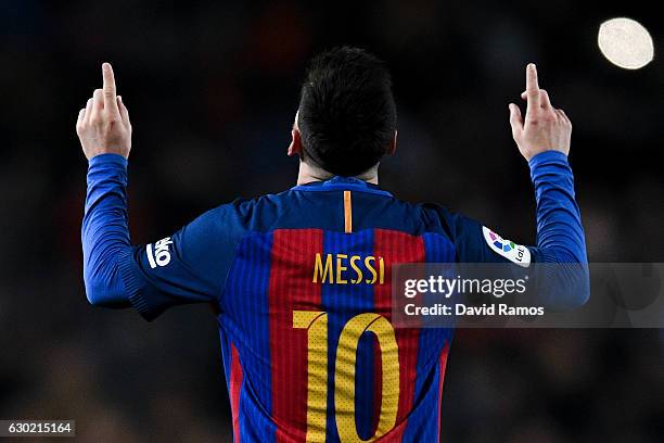 Lionel Messi of FC Barcelona celebrates after scoring his team's fourth goal during the La Liga match between FC Barcelona and RCD Espanyol at the...