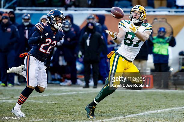 Jordy Nelson of the Green Bay Packers completes the pass for 60 yds, ahead of Cre'von LeBlanc of the Chicago Bears, in the fourth quarter at Soldier...