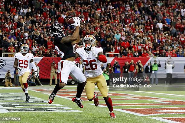 Taylor Gabriel of the Atlanta Falcons scores a touchdown against Tramaine Brock of the San Francisco 49ers during the first half at the Georgia Dome...