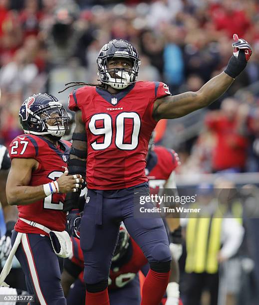 Jadeveon Clowney of the Houston Texans celebrates with Quintin Demps of the Houston Texans after a tackle in the fourth quarter against the...