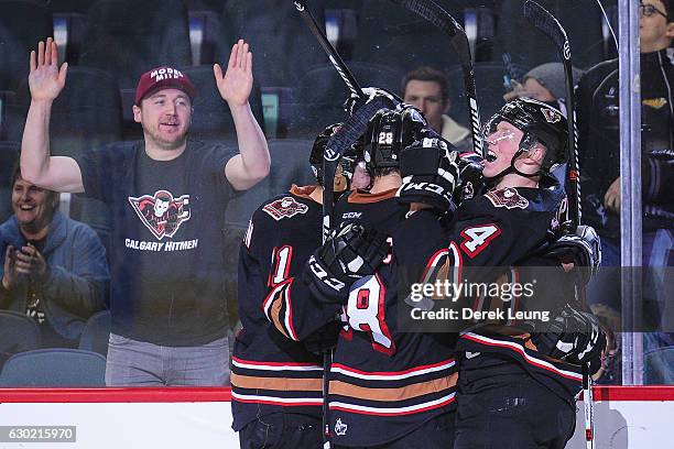 The Calgary Hitmen celebrate after Jordy Stallard scored the game-winning goal against the Kootenay Ice during a WHL game at Scotiabank Saddledome on...