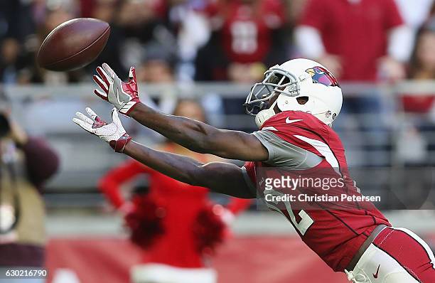 Wide receiver John Brown of the Arizona Cardinals reaches for the footbal but is unable to make the catch in the second half of the NFL game against...