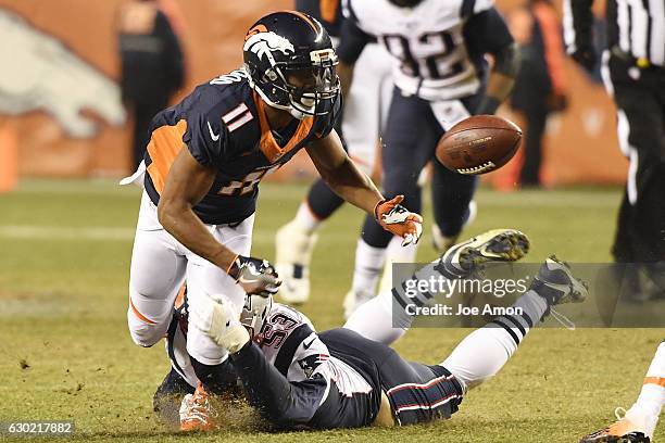 Jordan Norwood of the Denver Broncos fumbles as Kyle Van Noy of the New England Patriots hits him during the fourth quarter of the Patriots' 16-3 win...