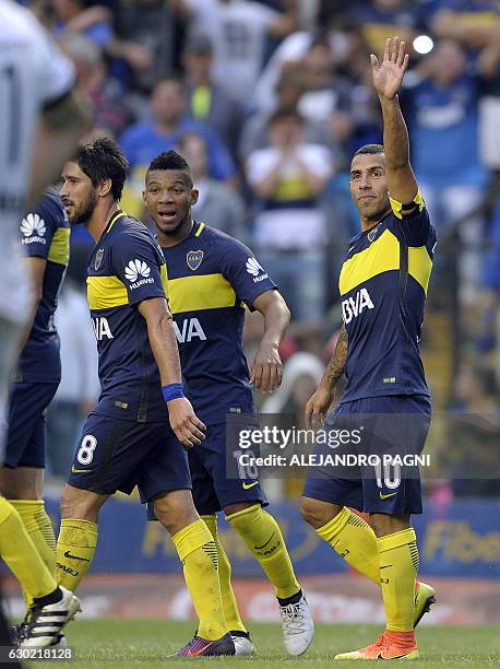Boca Juniors' forward Carlos Tevez celebrates after scoring the team;s second goal against Colon during their Argentina First Division football match...