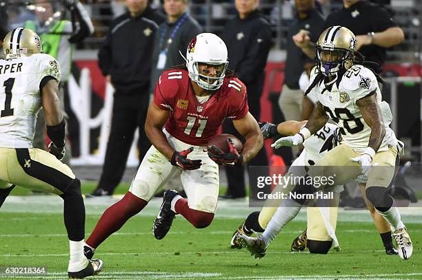 Wide receiver Larry Fitzgerald of the Arizona Cardinals runs with the football in NFL game against the New Orleans Saints at University of Phoenix...