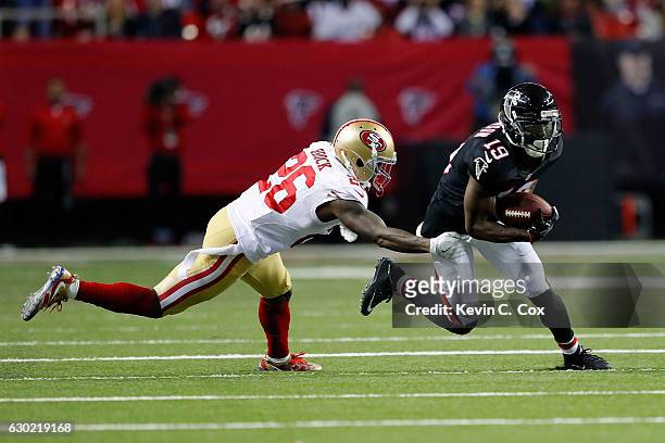 Aldrick Robinson of the Atlanta Falcons with a reception against Tramaine Brock of the San Francisco 49ers during the second half at the Georgia Dome...