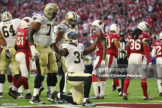 Running back Tim Hightower of the New Orleans Saints celebrates a three yard rushing touchdown against the Arizona Cardinals in the fourth quarter of...