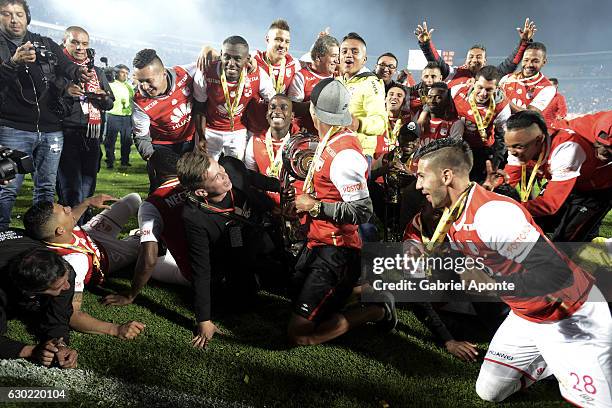 Players of Santa Fe celebrate with the trophy as champions of the Aguila League II 2016 after a second leg final match between Santa Fe and Deportes...