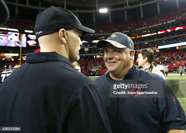 San Francisco 49ers head coach Chip Kelly speaks with Atlanta Falcons head coach Dan Quinn at the conclusion during an NFL football game on December...