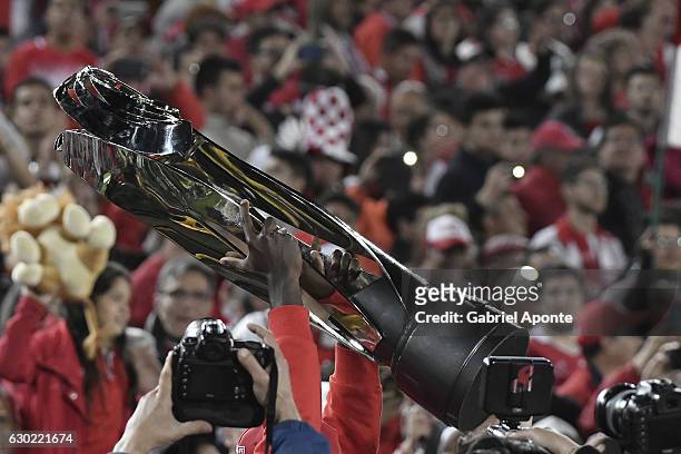 Player of Santa Fe lifts the trophy to celebrate after winning the Liga Aguila II 2016 tournament after a second leg final match between Santa Fe and...