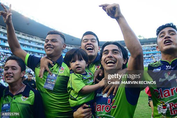 Santa Tecla's players celebrate after winning their 2016 El Salvador Apertura tournament final football match against Alianza F. C. At the Cuscatlan...