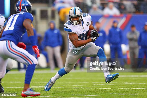 Detroit Lions running back Dwayne Washington runs during the second quarter of the National Football League game between the New York Giants and the...