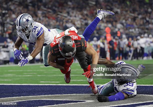 Adam Humphries of the Tampa Bay Buccaneers scores a touchdown on a deflected pass from Jameis Winston during the third quarter against the Dallas...