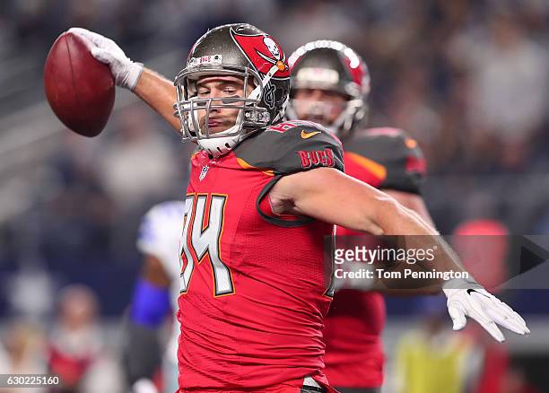 Cameron Brate of the Tampa Bay Buccaneers celebrates after catching a pass from Jameis Winston during the third quarter against the Dallas Cowboys at...