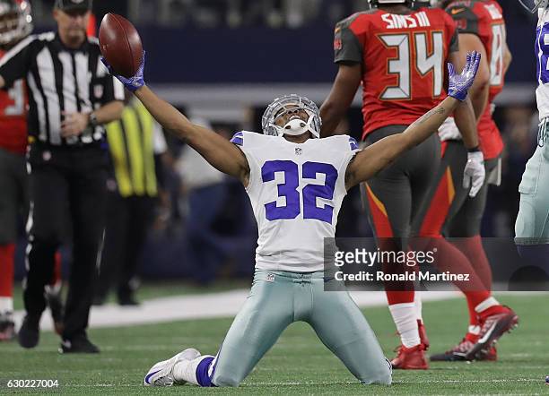 Orlando Scandrick of the Dallas Cowboys celebrates after intercepting a pass from Jameis Winston of the Tampa Bay Buccaneers during the fourth...