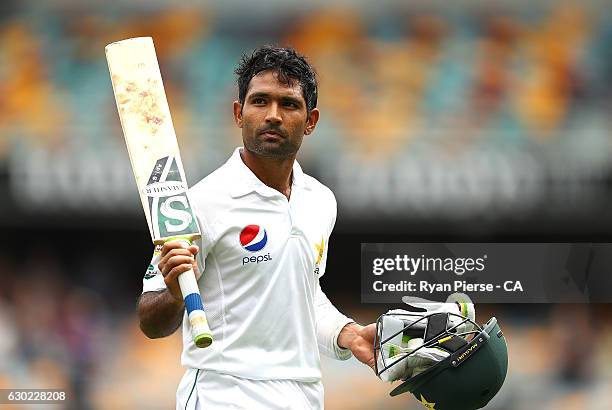 Asad Shafiq of Pakistan raises his bat after being dismissed by Mitchell Starc of Australia for 137 runs during day five of the First Test match...