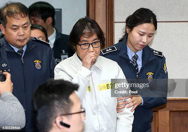 Choi Soon-Sil, the jailed confidante of disgraced South Korean President Park Geun-Hye, appears for the first day of her trial at the Seoul Central...