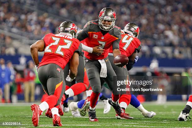 Tampa Bay Buccaneers Quarterback Jameis Winston hands the ball off to Running Back Doug Martin during the NFL Sunday night game between the Tampa Bay...