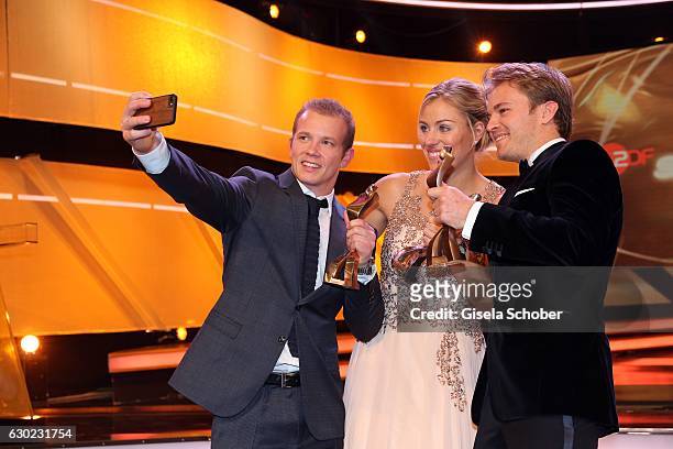 Fabian Hambuechen, Olympic gold medalist, champion, takes a selfie with Tennis Champion Angelique Kerber and Nico Rosberg, Formula One, F1 driver and...