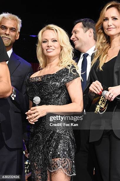 Satya Oblette, Pamela Anderson and Adriana Karembeu attend the 'Top Model Belgium 2017' Ceremony at Le Lido on December 18, 2016 in Paris, France.