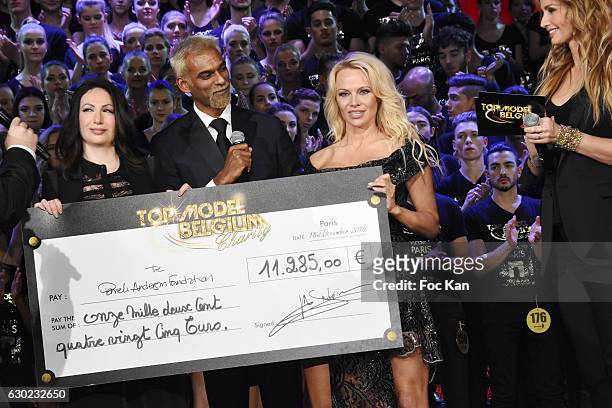 Satya Oblette and Jeremy Urbain offered a check to Pamela Anderson association during the 'Top Model Belgium 2017' Ceremony at Le Lido on December...