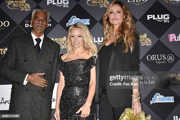 Satya Oblette, Pamela Anderson and Adriana Karembeu attend the 'Top Model Belgium 2017' Ceremony at Le Lido on December 18, 2016 in Paris, France.