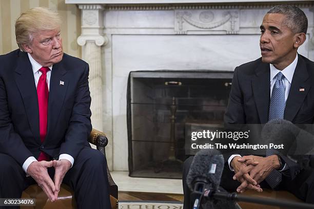 President Barack Obama and President-elect Donald Trump talk to members of the media during a meeting in the Oval Office of the White House in...