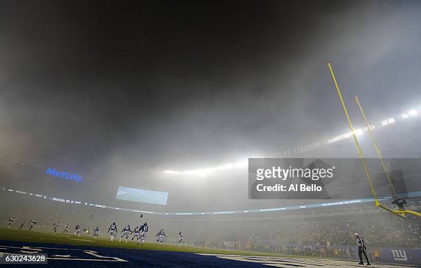 Bobby Rainey of the New York Giants looks for the ball after Dan Bailey of the Dallas Cowboys kicked the ball off to start the game at MetLife...