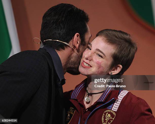 Juvents FC goalkeeper Gianluigi Buffon kisses the Gold medalist Beatrice Maria Vio of Rio 2016 Paralympic Games during the Italian Olympic Commitee...