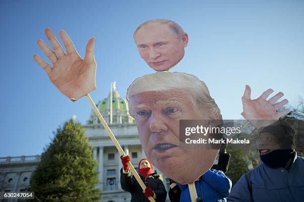 Donald Trump protestors demonstrate outside the Pennsylvania Capitol Building before electors arrive to cast their votes from the election at...