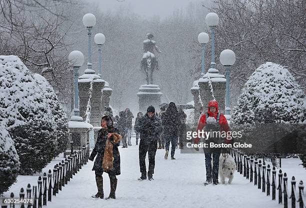 The first significant snow blanketed the region, as people came out to enjoy the snow in the Boston Public Garden in Boston on Dec. 17, 2016.