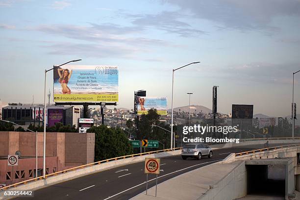 Billboard advertises a cosmetic surgeon by the side of a road in Tijuana, Mexico, on Sunday, Oct. 23, 2016. Data from a U.S. Government survey...