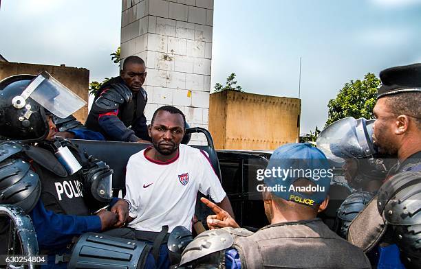 Security forces take into custody a protester as they take security measures just in case people stage a protest after postponing of the general and...