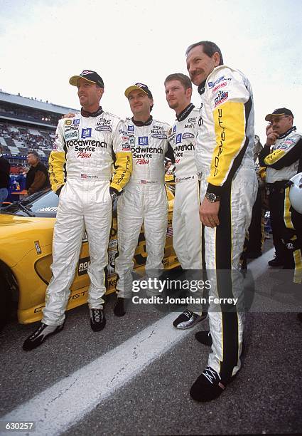 Dale Earnhardt, Dale Earnhardt Jr. Andy Pilgrim, Kelly Collins pose for a photo during the Rolex 24 Hours of Daytona at the International Speedway in...