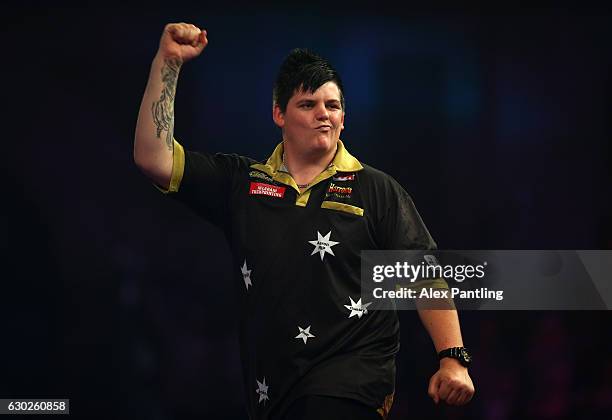 Corey Cadby of Australia celebrates victory in his preliminary round match against Qiang Sun of China during day five of the 2017 William Hill PDC...