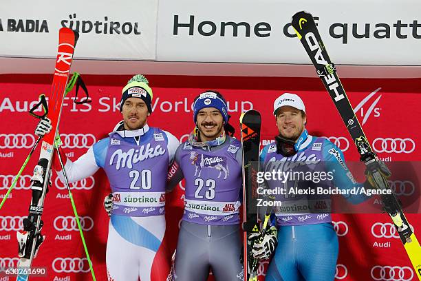 Carlo Janka of Switzerland takes 2nd place, Cyprien Sarrazin of France takes 1st place, Kjetil Jansrud of Norway takes 3rd place during the Audi FIS...