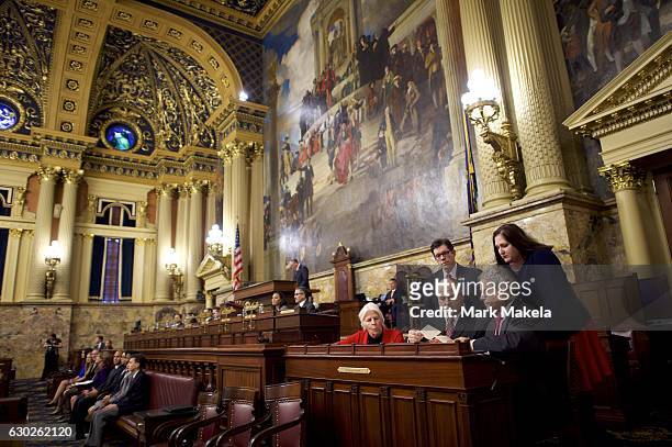Charlie Gerow and fellow tellers count the elector's votes from a ballot box in the House of Representatives chamber of the Pennsylvania Capitol...
