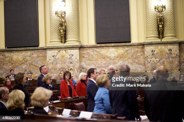 Electors arrive to cast their election ballots in the House of Representatives chamber within the Pennsylvania Capitol Building December 19, 2016 in...