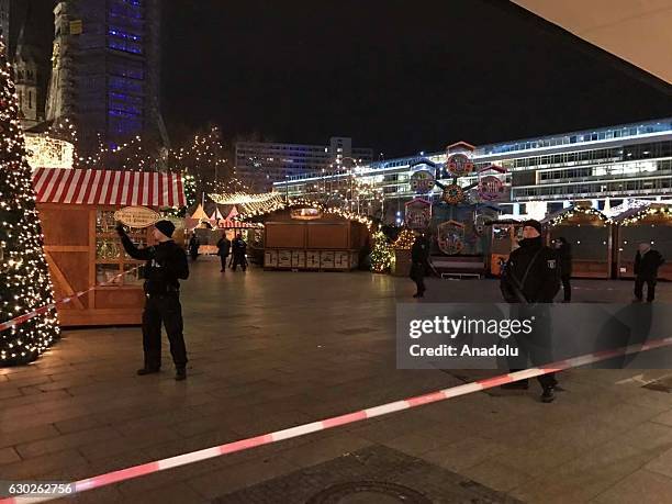 Police take security measures after a truck plough into a crowd at a Christmas market site in Berlin, Germany on December 19, 2016. Several injuries...