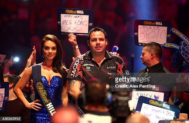 Adrian Lewis of England walks on prior to his first round match against Magnus Caris of Sweden during day five of the 2017 William Hill PDC Darts...
