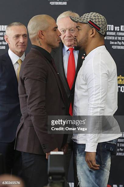 Miguel Cotto, Jerry Jones and James Kirkland pose during a press conference to promote the fight between Miguel Cotto and James Kirkland at the Ford...