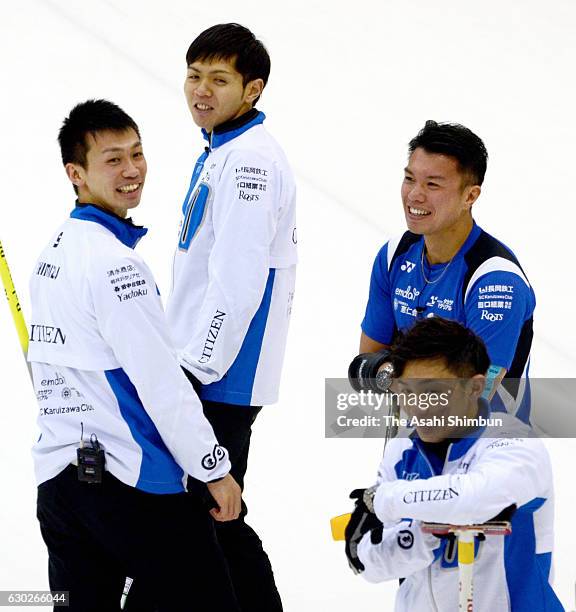 Members of Team Karuizawa smile in the third place match against a Canadian team during day four of the Karuizawa International Curling Championships...