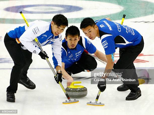 Tetsuro Shimizu of Team Karuizawa delivers the stone in the third place match against a Canadian team during day four of the Karuizawa International...